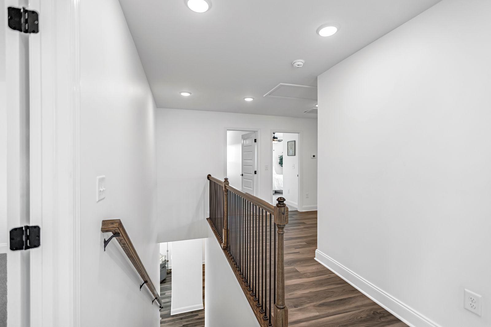 Amber Vista guest bedroom with natural light and ceiling fan