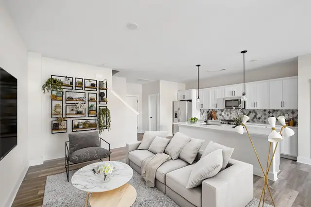 Allston open concept living space with balcony access