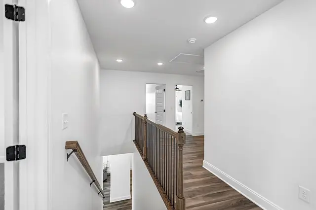 Amber Vista guest bedroom with natural light and ceiling fan
